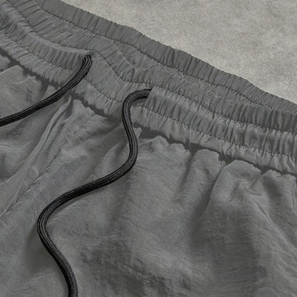 Snabborkande träningsbyxor för herr med sidoränder