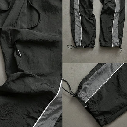 Snabborkande träningsbyxor för herr med sidoränder