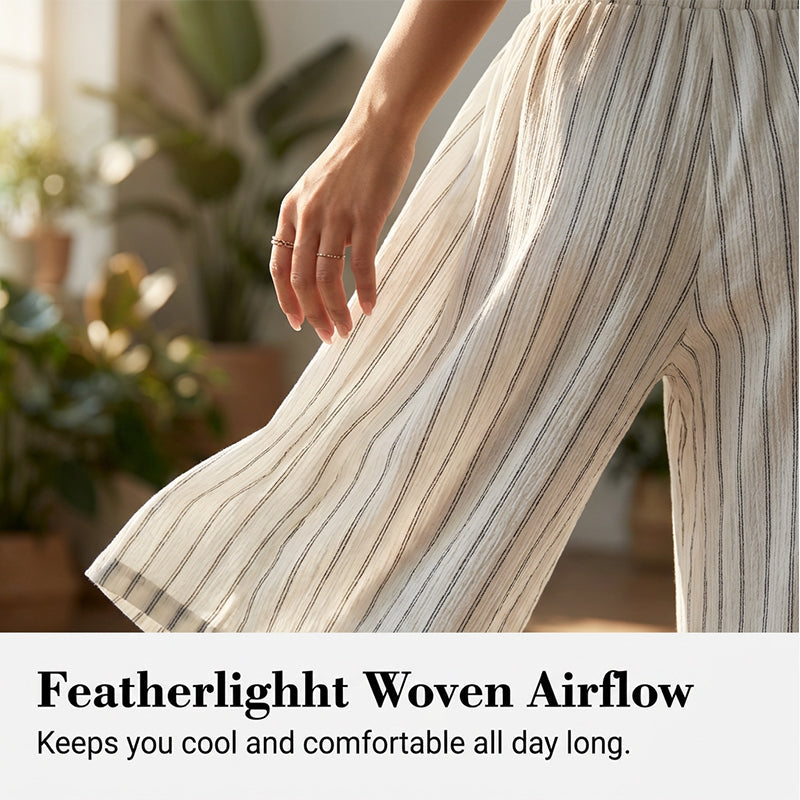 Randiga byxor med dragsko och vida ben för dame