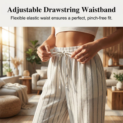 Randiga byxor med dragsko och vida ben för dame