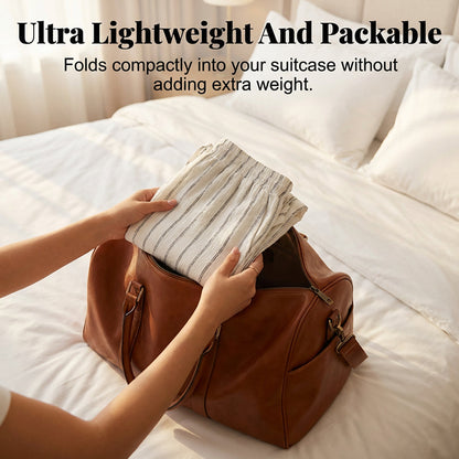 Randiga byxor med dragsko och vida ben för dame