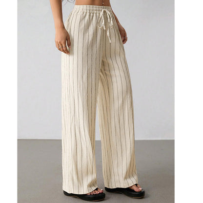 Randiga byxor med dragsko och vida ben för dame