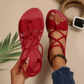 Platta sandaler med korsade remmar för dam
