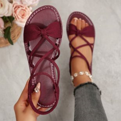 Platta sandaler med korsade remmar för dam