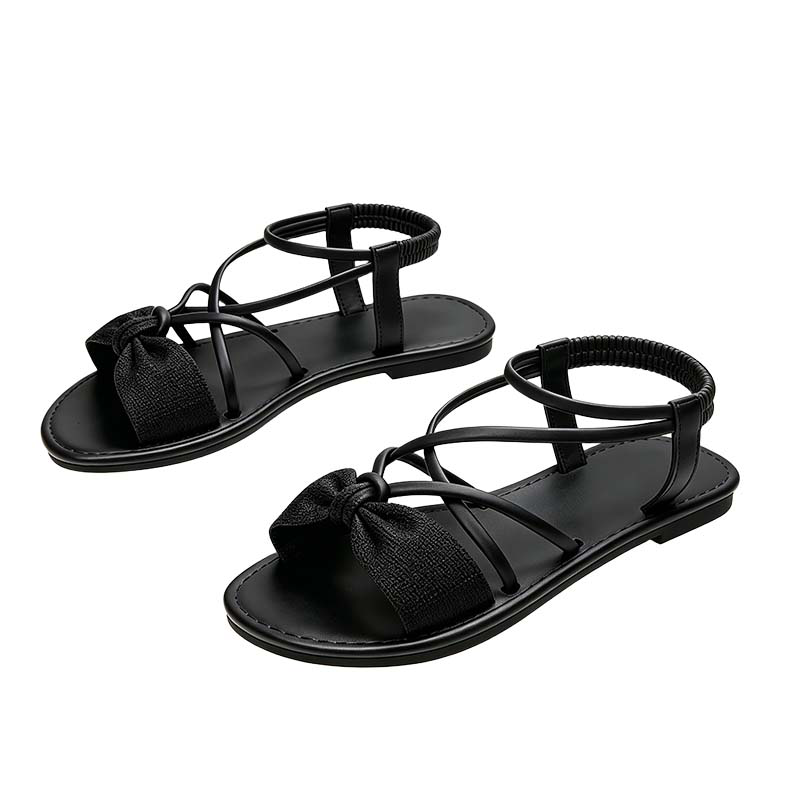 Platta sandaler med korsade remmar för dam